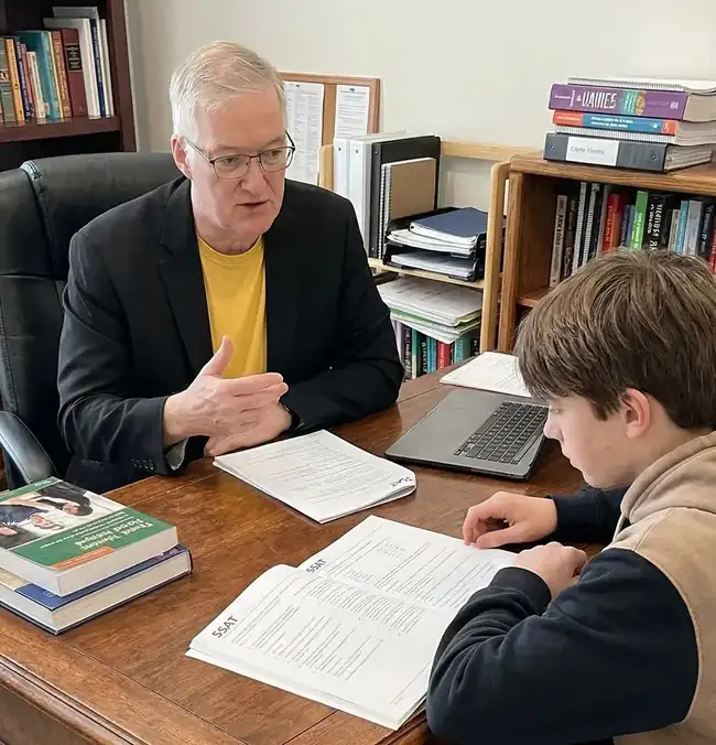 Dr. Donnelly preparing a student for the SSAT exam with practice materials